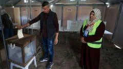 Palestinians in West Bank and some in Gaza vote in local elections
