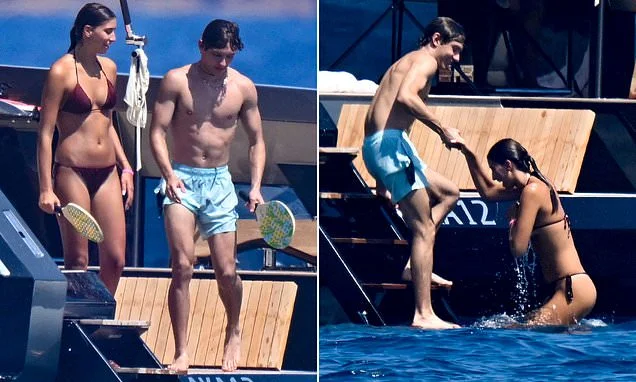 F1 star Kimi Antonelli, 19, enjoys a yacht holiday with bikini-clad mystery woman following split from ex Eliska Babickova - after finishing first half of the season leading the championship