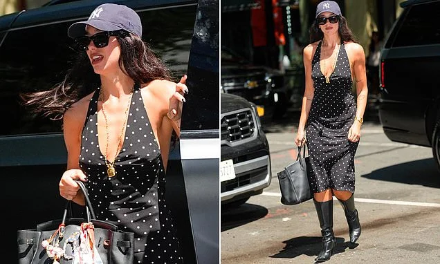 Dua Lipa embraces the New York heatwave in a low-cut spotted dress and carries a £22k Hermes Birkin bag as she heads out in the city