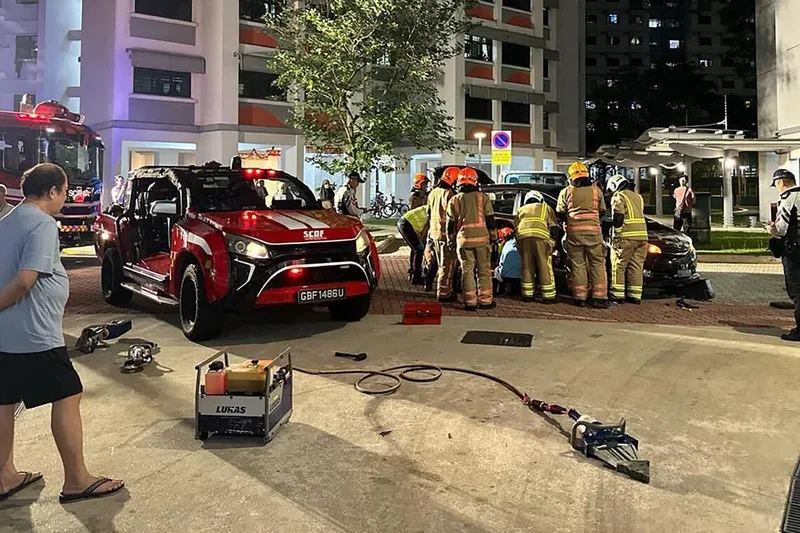 Domestic helper rescued after leg was pinned under car in Sembawang