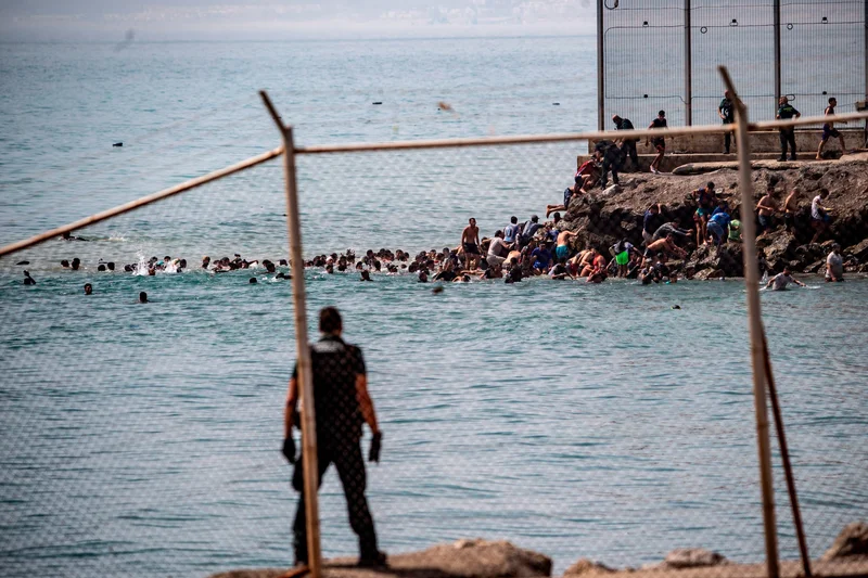 ‘Not Morocco!’ Thousands of migrants enter Ceuta and beg not to be sent back