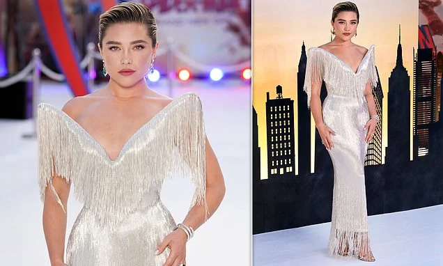 Florence Pugh looks sensational in a silver tassel gown with statement neckline as she poses at the star-studded Spider-Man premiere