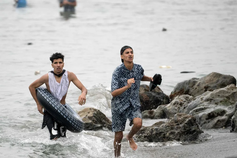 60,000 cross into Spanish territory of Ceuta and at least 34 die after border breach
