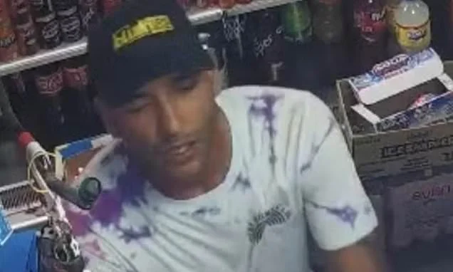 Hunt is launched for man after 'woman is approached by stranger on the street, dragged into a building and sexually assaulted'