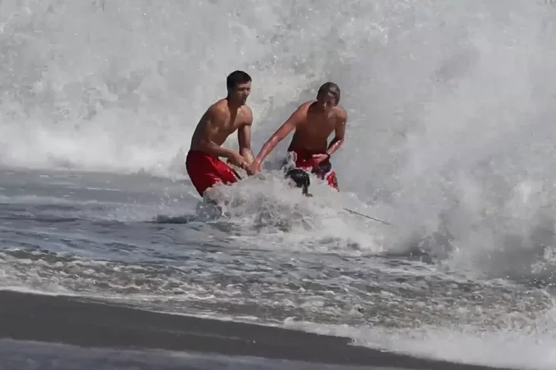 Dramatic rescue sees lifeguards battle terrifying waves to save boy off California