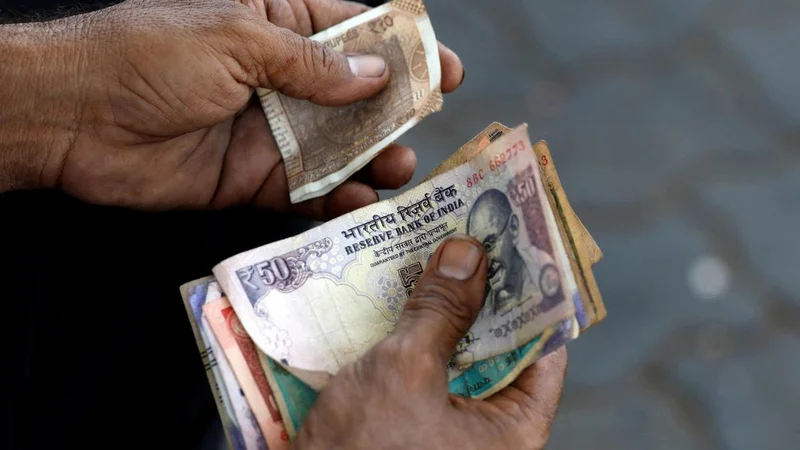 Rupee rises 11 paise to settle at 95.88 against U.S. dollar
