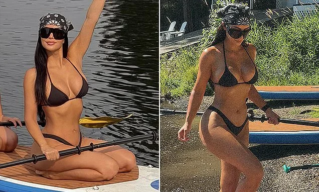 Kim Kardashian hits the lake in a bikini as she makes surprise U-turn in legal battle with man ordered to pay her $167k in legal fees