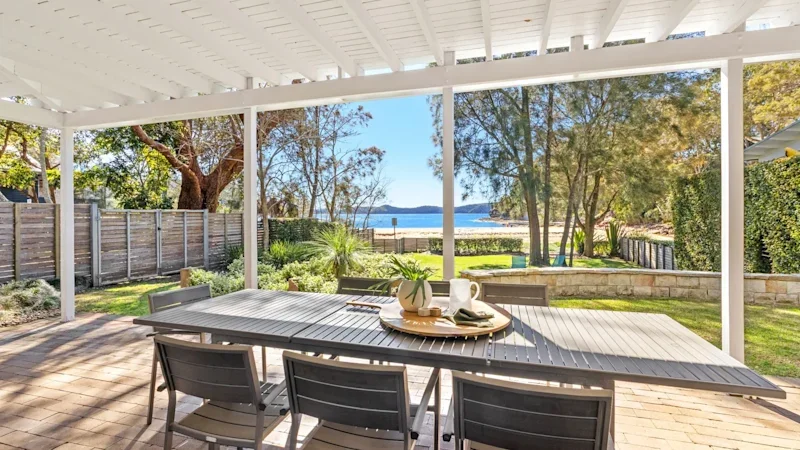 Sydney’s BridgeClimb founder drops asking price for coastal home