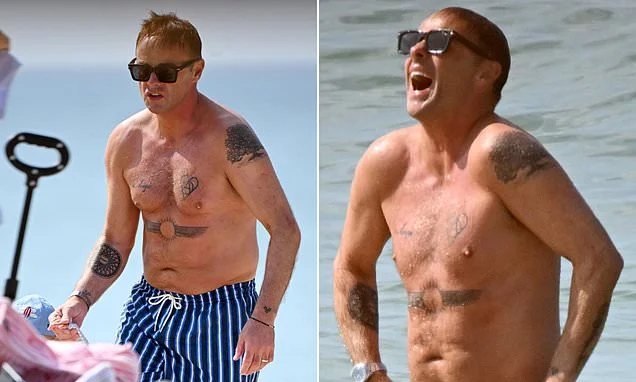 Ant McPartlin shows off his shirtless physique as he enjoys a family holiday with his wife Anne-Marie after revealing he was caught naked in a Thai massage parlour