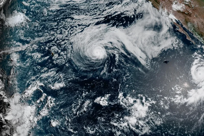 Hurricane Genevieve roars in the Pacific as Fausto weakens to a tropical storm near Hawaii