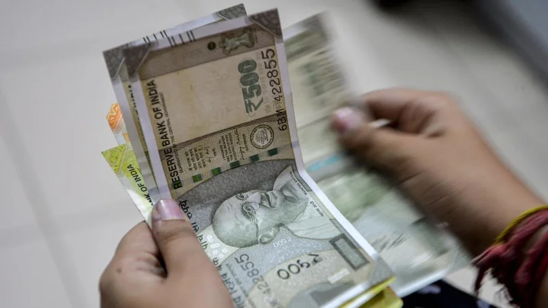 Rupee surges 61 paise to settle at 95.92 against U.S. dollar