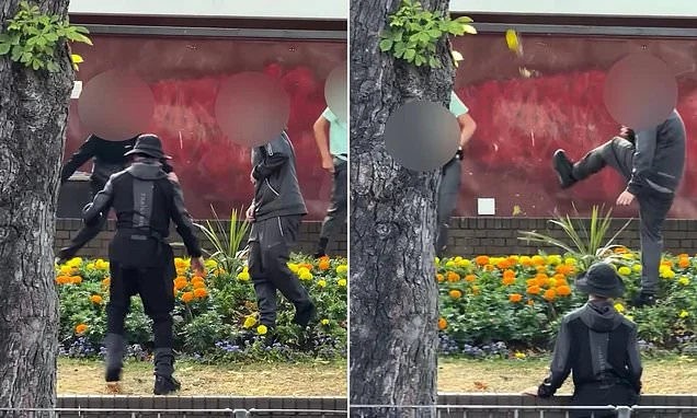 Moment gang of youths laugh as they destroy town centre flower bed during summer holidays