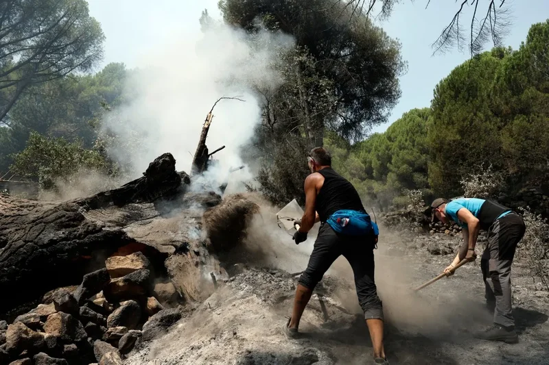 Thousands of evacuees return home as firefighters contain Spain's blazes