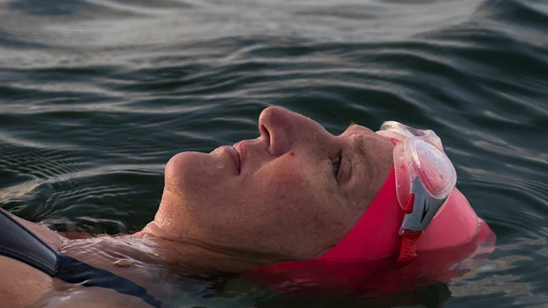 The ocean took her husband while he was saving their kids. Now she finds peace in the water