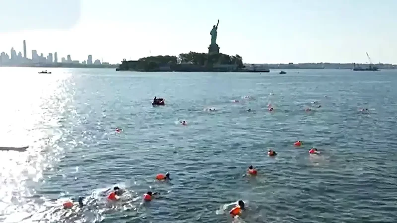 Retired Navy SEALS plunge into New York Harbor for patriotic swim honoring service and sacrifice