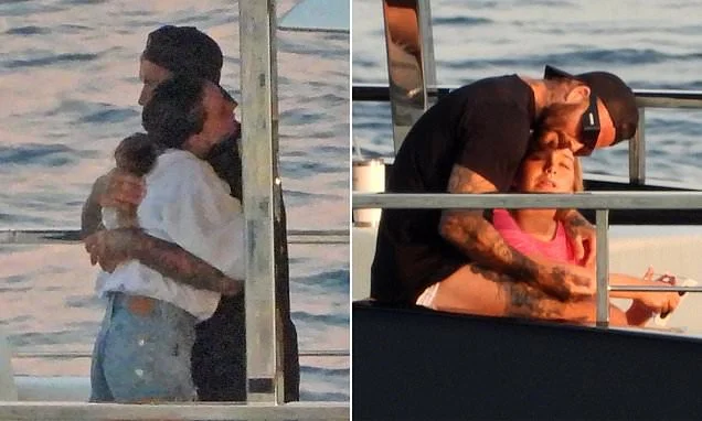 Posh and Becks have a rare PDA moment before David cuddles up to daughter Harper to enjoy the solar eclipse on board £16million Beckham family yacht in Portofino