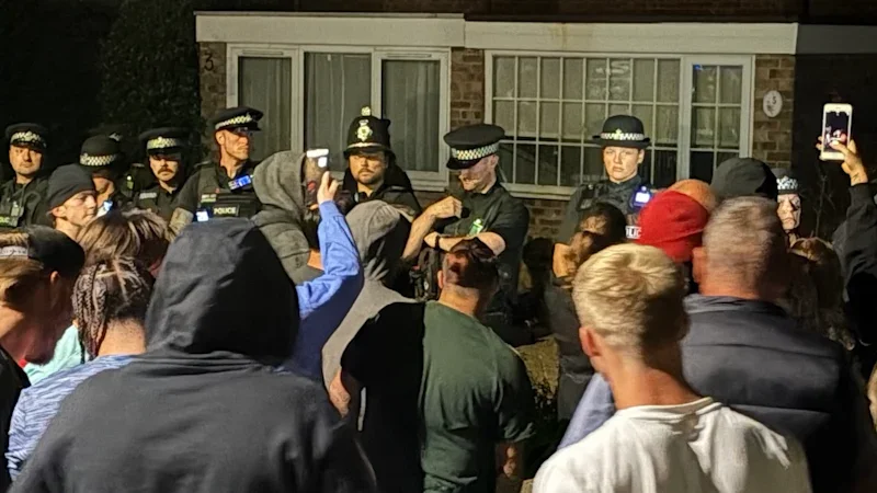 Police injured as protesters descend on homes for asylum seekers in England
