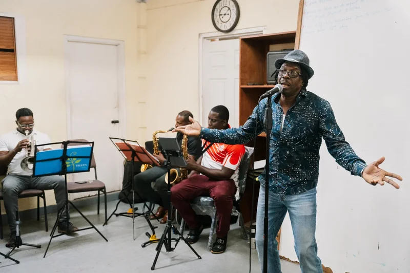 Suspended priest on tiny Caribbean island turns to music to make his voice heard