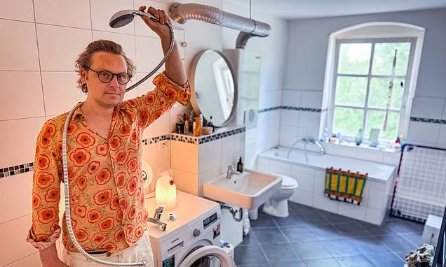 Man is ordered to remove his shower because it would push up neighbourhood rent prices