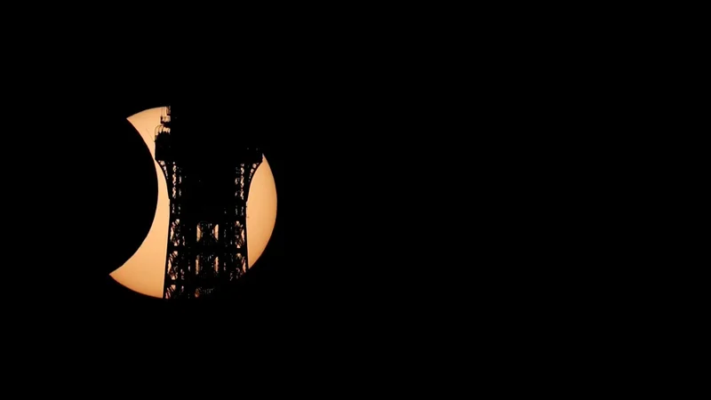 Solar eclipse carves Eiffel Tower’s silhouette in Paris sky
