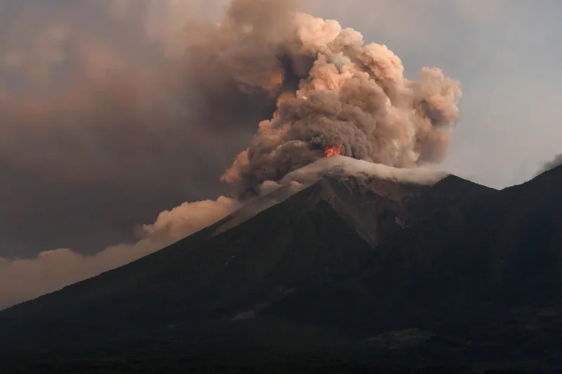 Guatemala’s most dangerous volcano erupts as families flee and lava races downhill