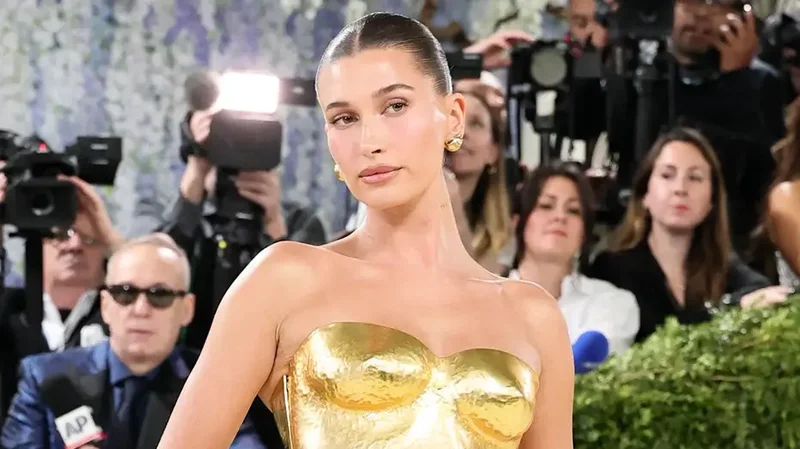 Hailey Bieber shows off toned figure in tiny yellow bikini while sharing summer snaps