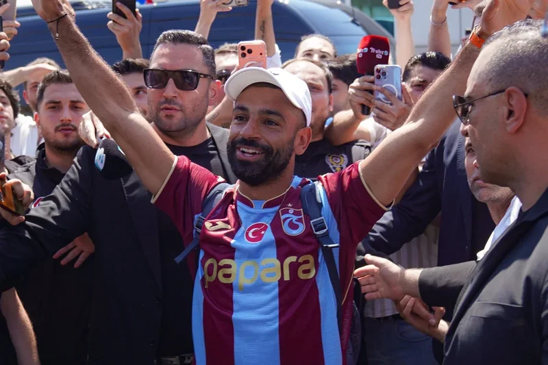 Trabzonspor fans mob Mo Salah as he arrives in Turkey wearing kit