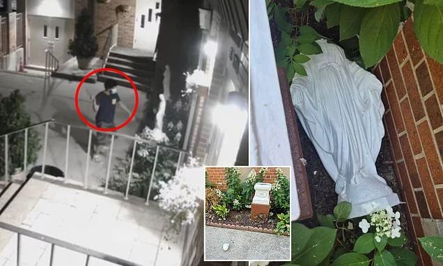 Bearded man filmed vaulting into NYC Catholic Church yard to smash statue of Virgin Mary to smithereens with hammer