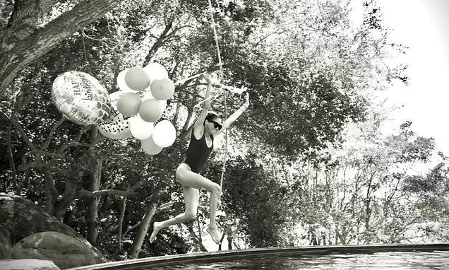 Meghan makes a splash for her 45th! Duchess of Sussex celebrates her milestone birthday with new photos of her diving into a pool while holding a bunch of balloons
