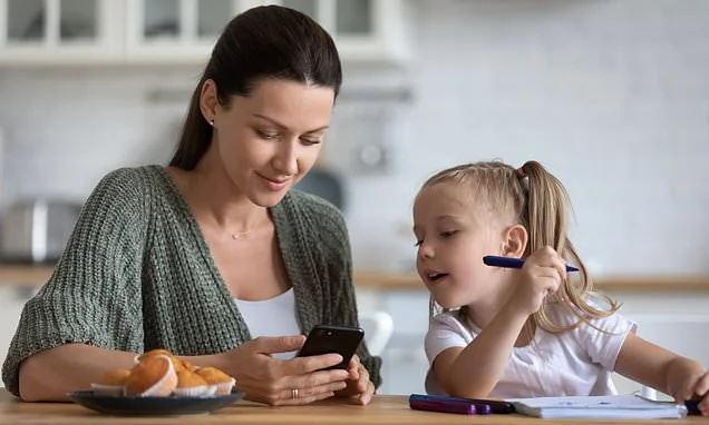 Scrolling on your phone in front of a child is worse for their brain than giving them a screen, study finds