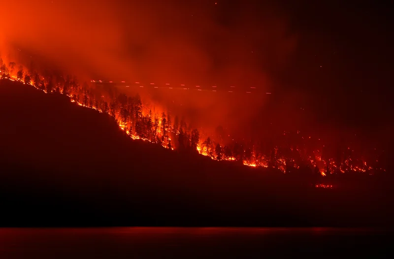 Highway reopens on a limited basis through Summerland in B.C. fire zone