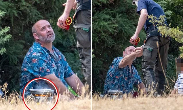 What a blazing idiot! Ranger has stern word with man cooking over open flame near prime minister's country home as wildfires burn across the UK