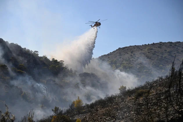Two dead and hundreds evacuated after wildfires on Greek island