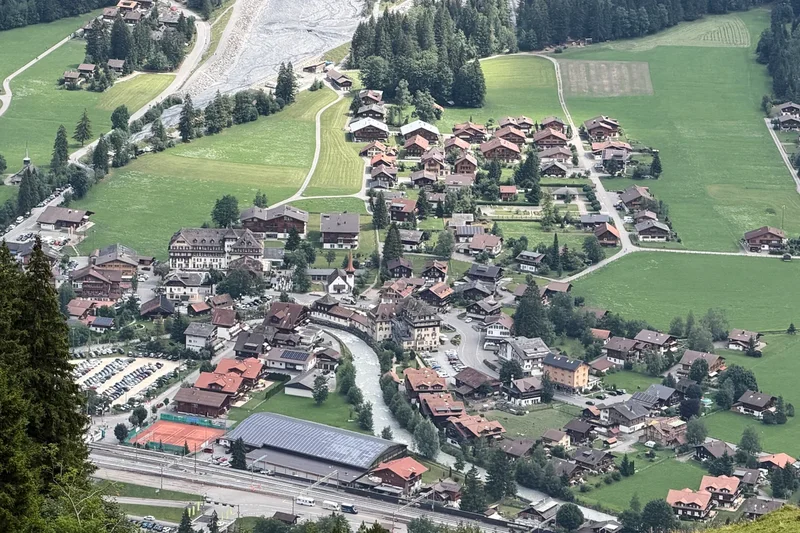 A looming rock collapse threatens a Swiss village as thawing permafrost destabilizes the Alps