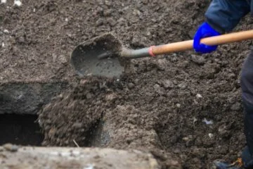 Two men suspected of helping grave robber sell stolen valuables