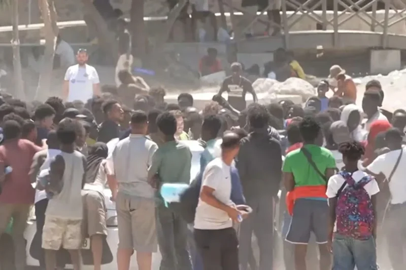 Migrants fight over aid on Ceuta beach as hundreds set up camp