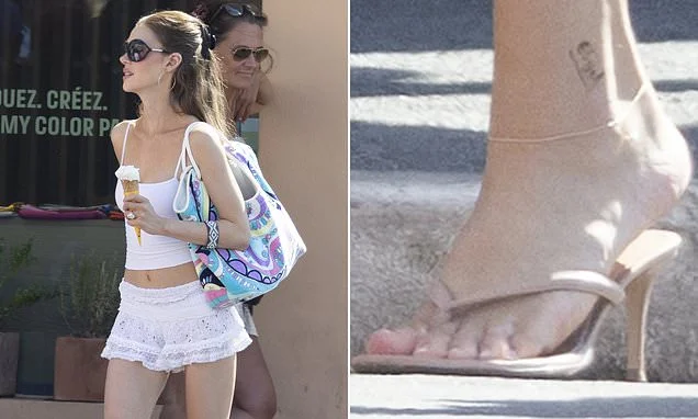 Nicola Peltz debuts new 'Elijah' ankle tattoo after Brooklyn had his family inkings removed amid feud
