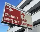 Public urged to avoid hospital unless ‘life might be in danger’ after record day for Sydney emergency departments