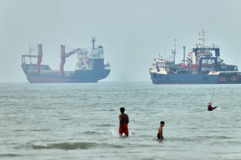 Cargo ship reports being struck in Strait of Hormuz as US, Iran claims about talks diverge