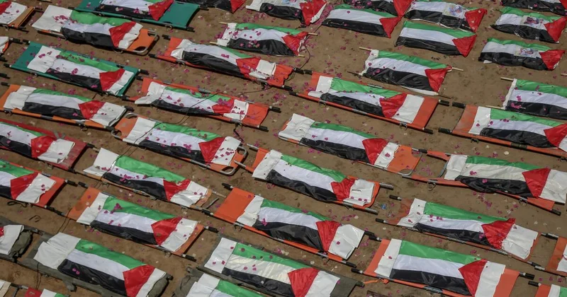 Bones, flags, and faded hope: Gaza City bids farewell to 112 killed in airstrike