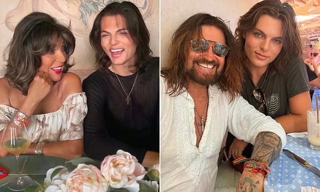Joan Collins, 93, looks glamorous in a strapless dress as she enjoys lunch in St Tropez with Elizabeth Hurley's son Damian and Billy Ray Cyrus