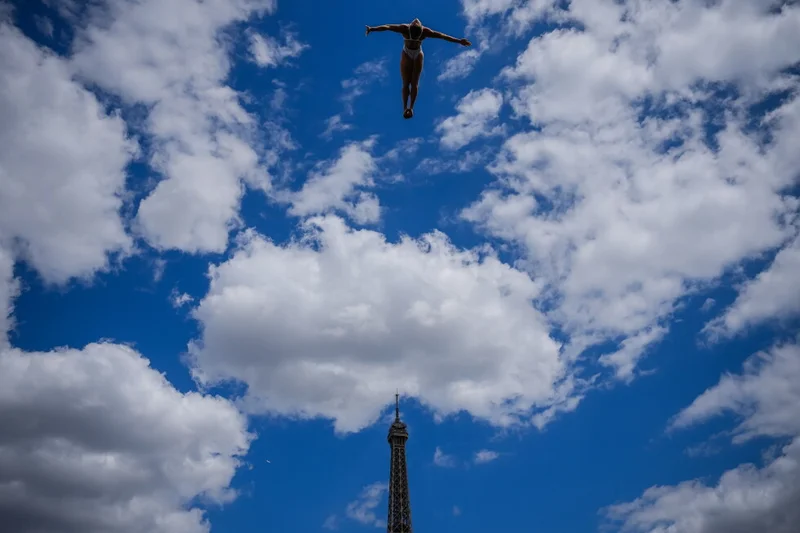 Diving into the blue sky, watched by the Eiffel Tower