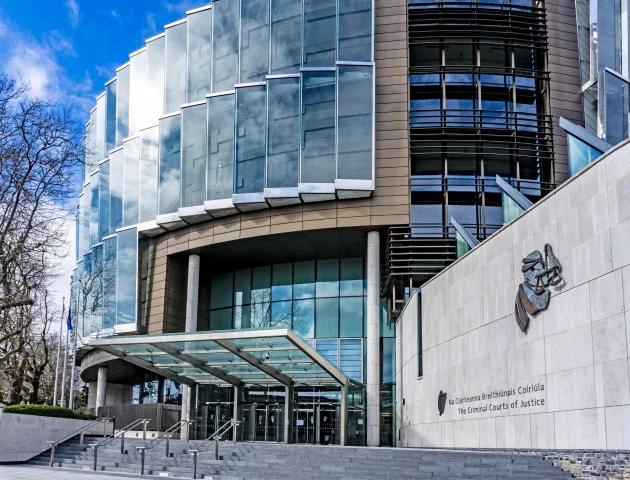 Garda appears before court charged with seeking to hire hitman to murder four people