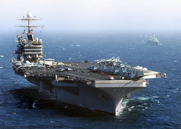 Families of sailors on US aircraft carrier say loved ones are despairing after 250 days at sea