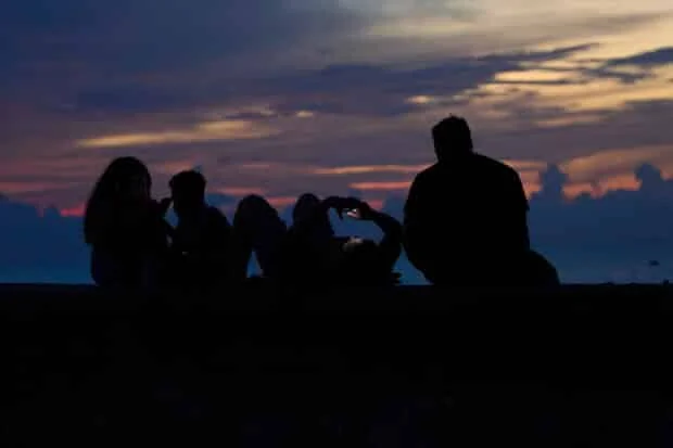Cubans sleep on seaside boardwalk for relief from blackouts, heat
