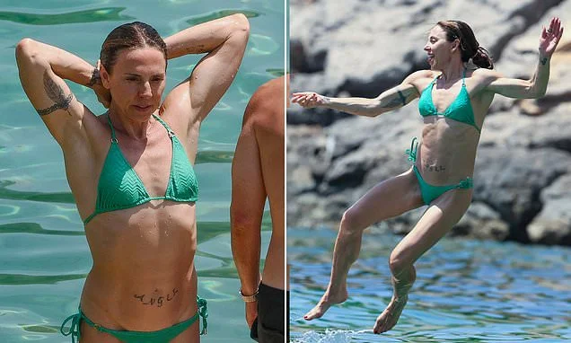 Mel Sea! Sporty Spice shows off her jaw-dropping abs in a green bikini as she enjoys boat day with her new husband Chris Dingwall during Ibiza honeymoon