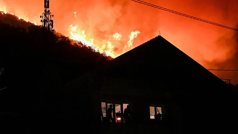 Wildfires rage across Europe as tourists and residents forced to flee