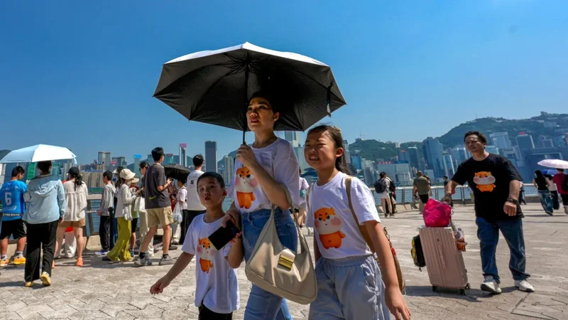 Hong Kong breaks record for hottest day as Typhoon Dolphin brings extreme heat
