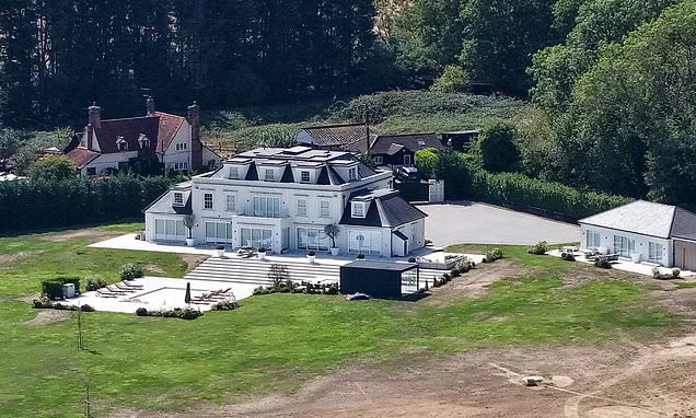 Mark Wright and Michelle Keegan's VERY green grass stands out next to the dry surroundings during record-breaking drought