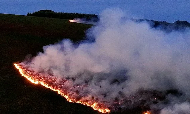 Twenty wildfires rage across south Wales as exhausted firefighters reinforced by 200 soldiers battle tinder dry conditions